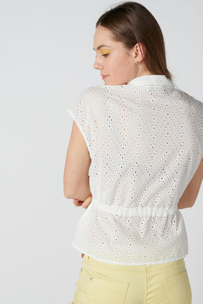 White eyelet short-sleeve peplum top with allover pattern, back view