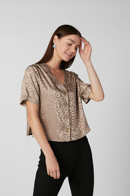 Brown patterned short-sleeve blouse with button front and round neckline