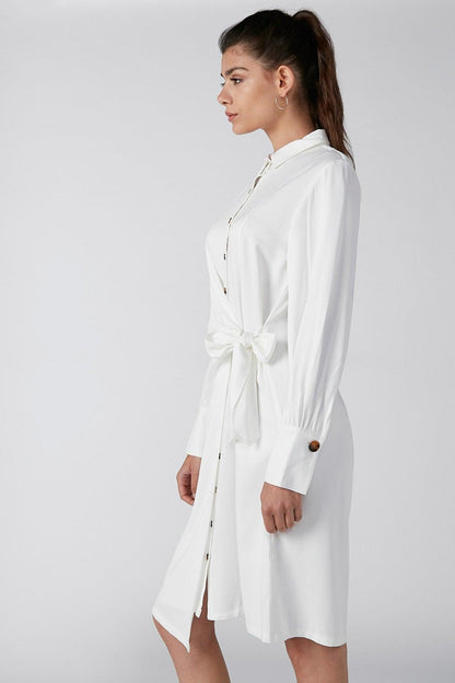 White long-sleeve shirt dress with high collar and belt tie at waist, button cuffs