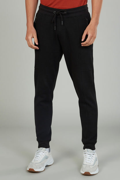Black jogger pants with drawstring waist and tapered legs