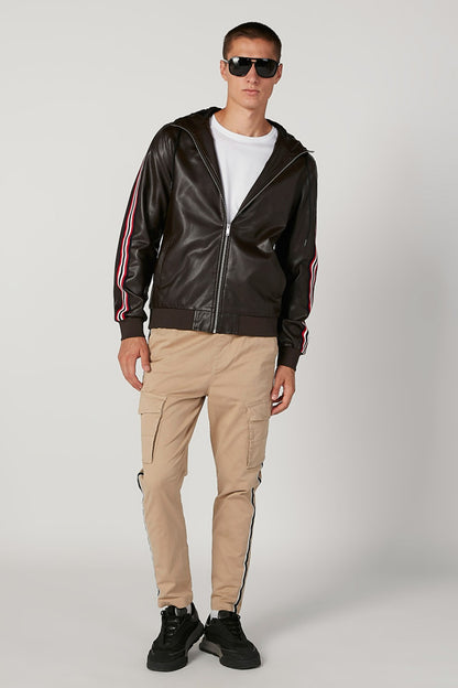 Dark zip-up jacket with stand collar and red/white/blue sleeve stripes, side pockets