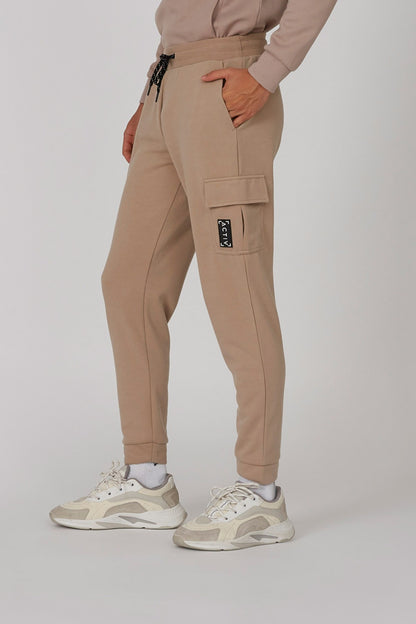 Brown cargo jogger pants with drawstring waist, side cargo pockets, cuffed ankle
