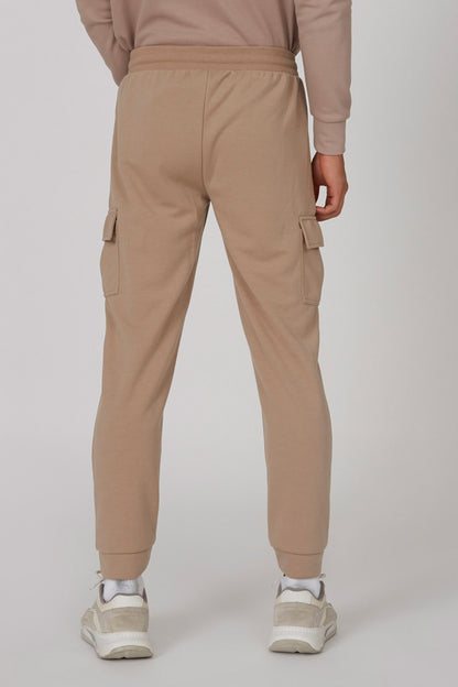 Brown cargo jogger pants, elastic waistband, side flap pockets, tapered cuff hem