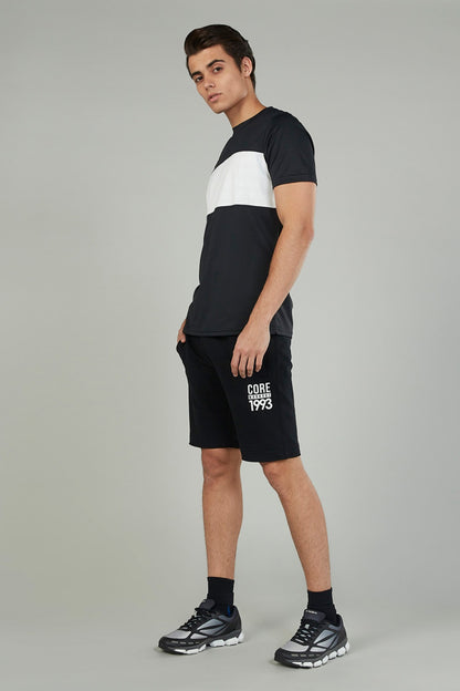 Black athletic shorts with drawstring waist and 'CORE 1993' logo on left leg