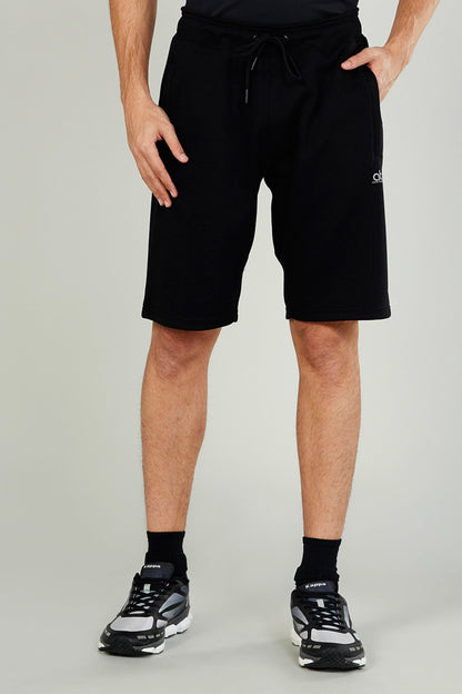 Black drawstring athletic shorts with side seam pockets and small side logo