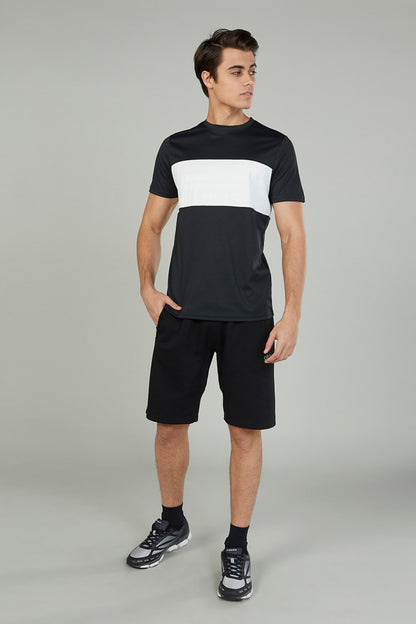 Black athletic shorts with drawstring waist, knee-length cut, and small side logo