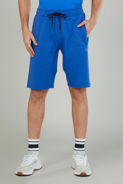Blue drawstring athletic shorts with side pockets, knee-length.