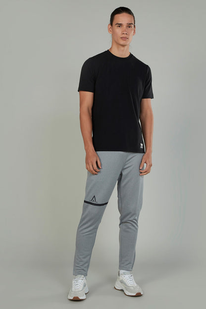 Men's grey sweatpants with tapered leg and logo knee patch