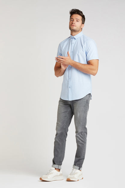 Grey denim jeans with belt loops, button fly, five pockets, straight fit