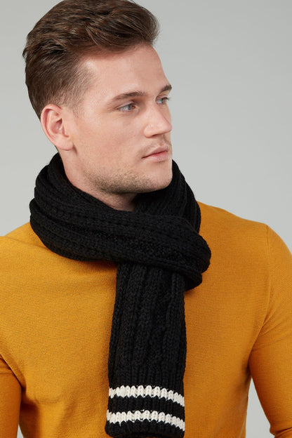 Black knit scarf with two white stripe bands, worn around neck
