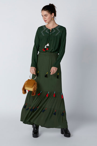 Green long-sleeve midi dress with colorful tassel trim and embroidered front