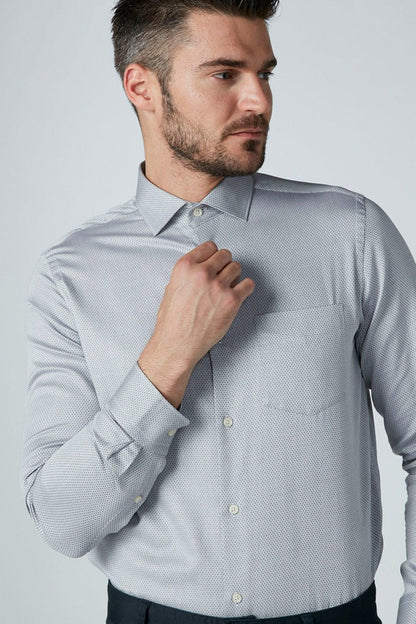 Men's grey button-up dress shirt, buttoned collar close-up
