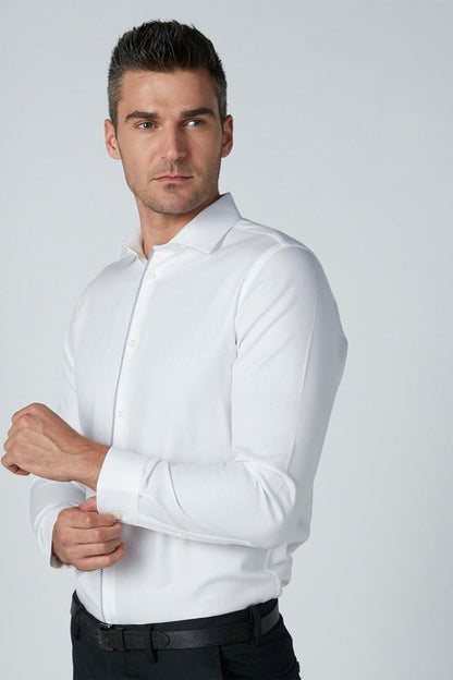 Men's white long-sleeve button-up dress shirt, close-up upper body with collar.