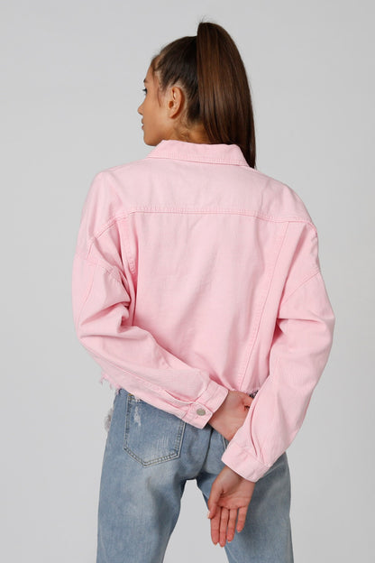Pink cropped denim jacket back view with button closure, yoke seam and collar