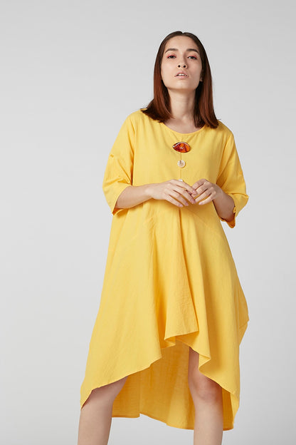 Yellow asymmetrical tunic dress with short sleeves, loose fit and scoop neckline