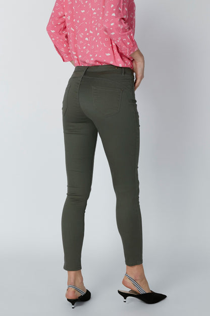 Women's dark green slim ankle pants with tapered leg and ankle-length hem