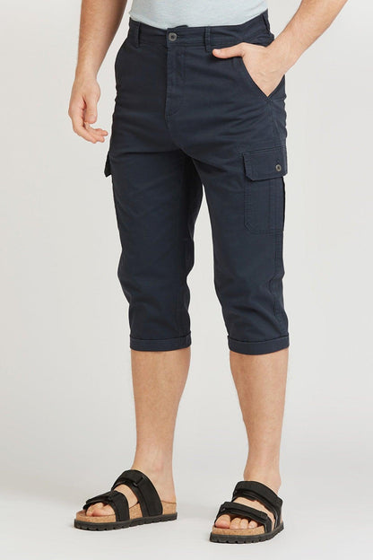 Navy cargo capri shorts with button flap pockets, belt loops, and cuffed hem