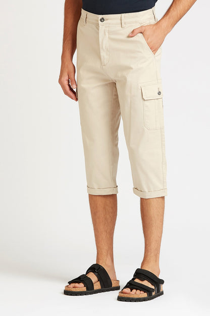 Beige cargo capri shorts with button-flap side pockets and cuff hem