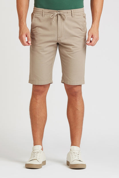 Beige drawstring casual shorts with front pockets and cuffed hem