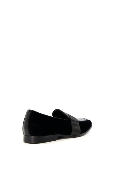 Dune London black loafer with dark strap, rounded toe, and low stacked heel