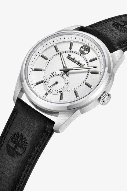 Timberland watch angled view, silver case, white dial with subdials, black leather strap.