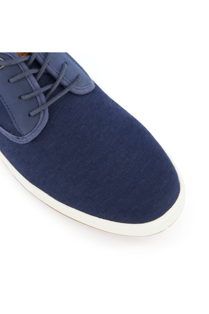 Dune London navy lace-up sneaker side view with textured canvas upper