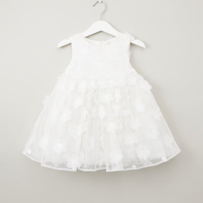 White sleeveless baby dress with tiered tulle ruffle skirt, round neck