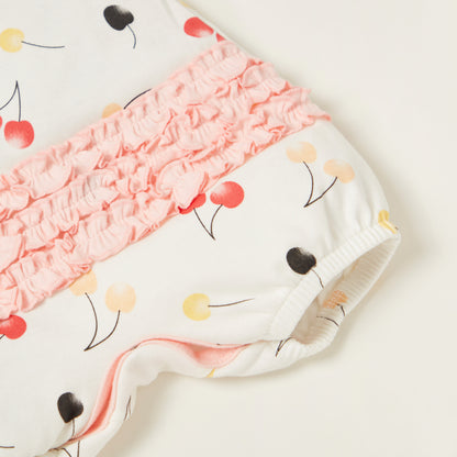 Baby cherry-print romper detail with ruffled pink neckline and elastic leg cuff