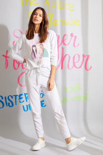 Light grey long-sleeve jumpsuit with colorful front graphic, drawstring waist and jogger legs