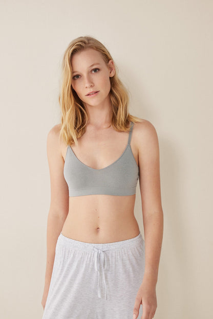 Grey bralette with thin straps and matching drawstring lounge pants