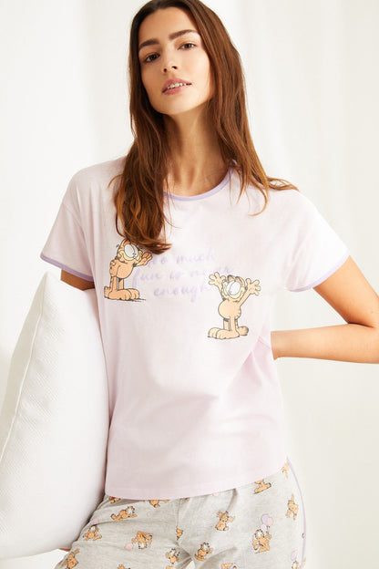 Women'secret pajama set: light purple short-sleeve tee and capri pants with cartoon print