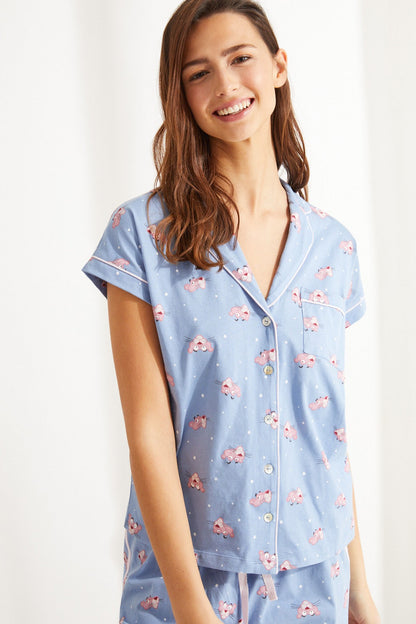 Light blue button-front pajama shirt with collar and multicolor print