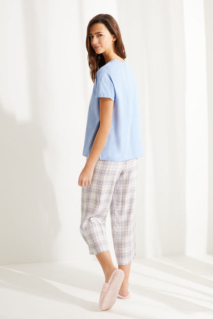 Women'secret light blue short-sleeve top with plaid cropped pants and pink slippers
